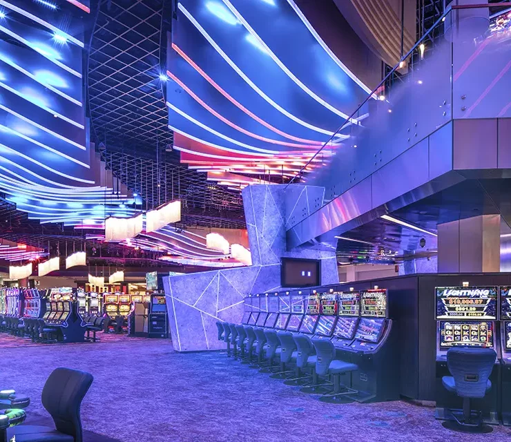 Slot machine area with dynamic blue and purple wave ceiling features