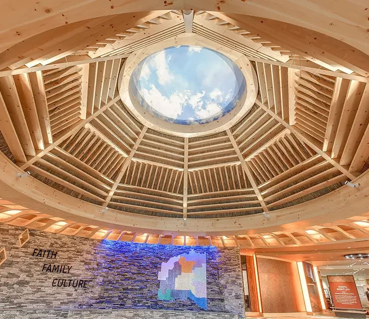 Large circular rotunda ceiling with wood ribs and central skylight